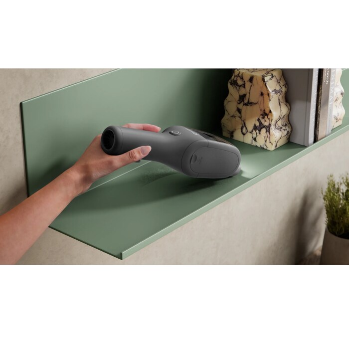 Product vacuuming fine dust on a shelf
