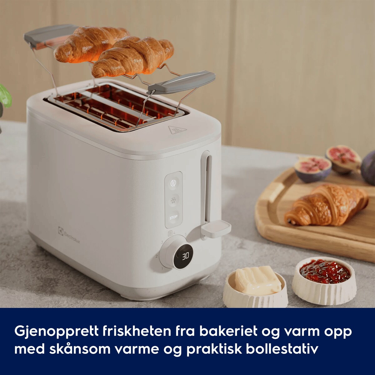 Gjenopprett friskheten fra bakeriet og varm opp med skånsom varme og praktisk bollestativ