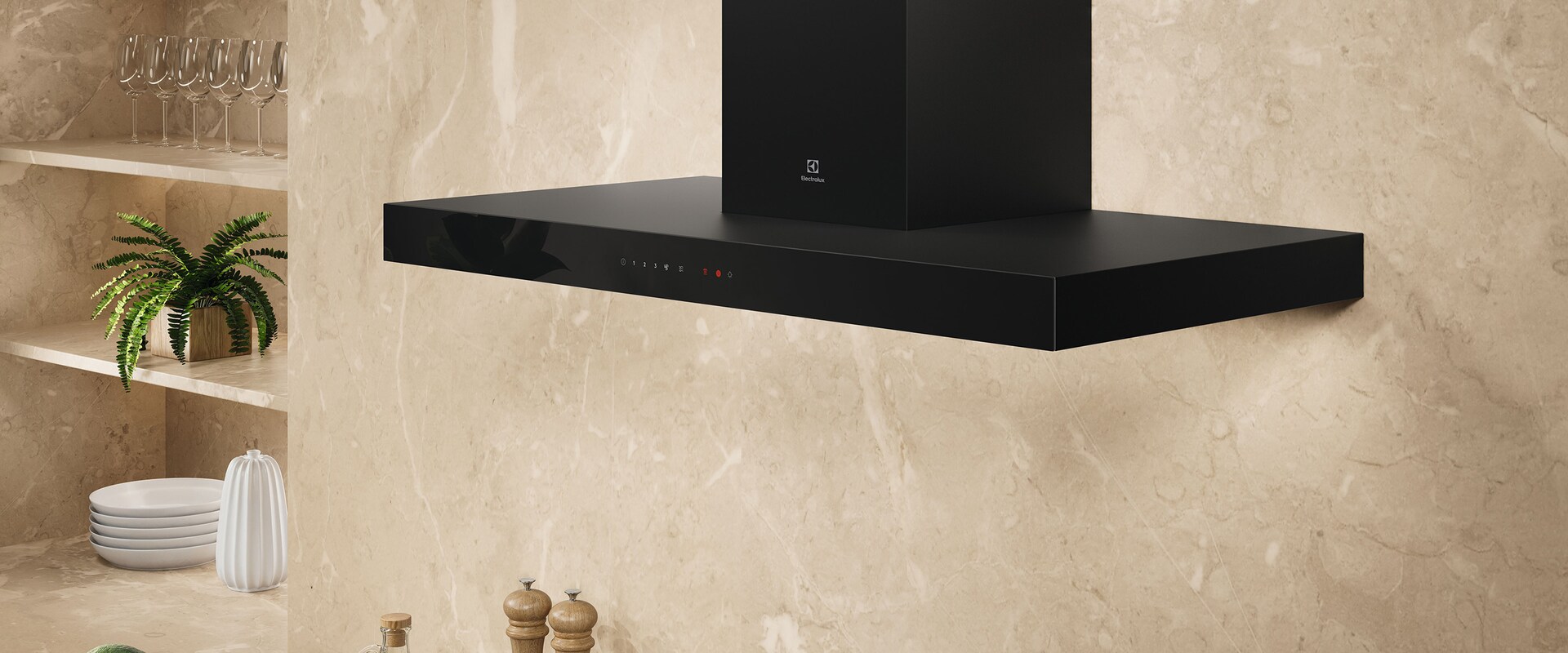 En svart kjøkkenvifte plassert på en beige vegg på et kjøkken.